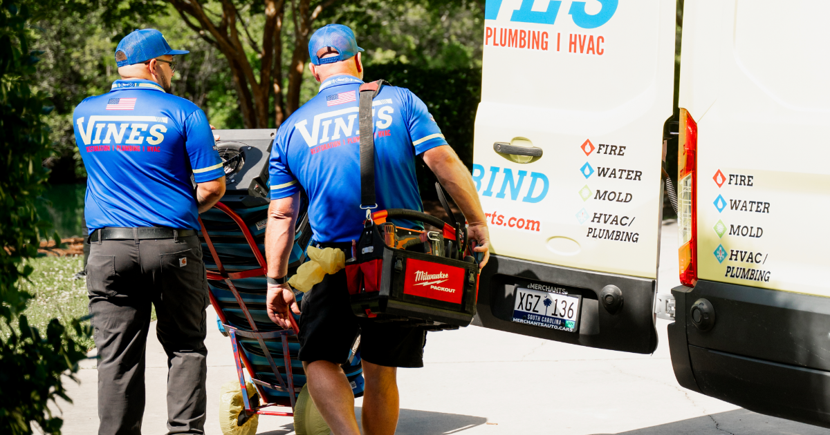 Two technician from Vines Restoration working for Air Conditioning Installation in Conway, SC