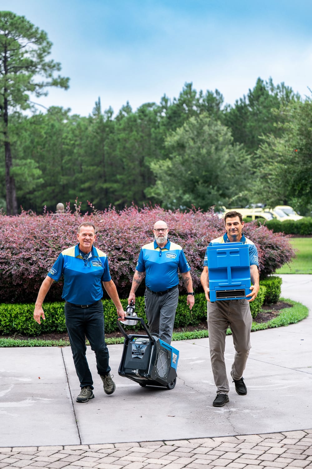 Vines team members wearing their uniforms.