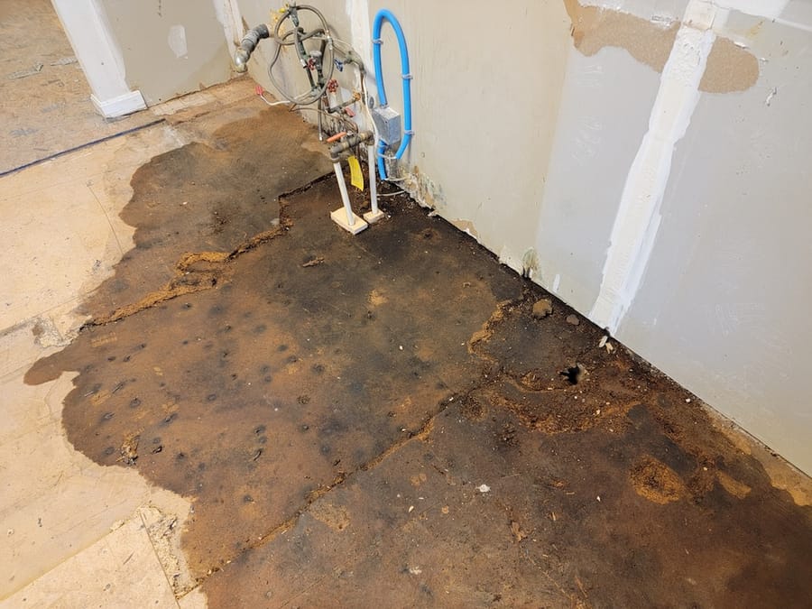 Exposed damaged floor after slab leak.
